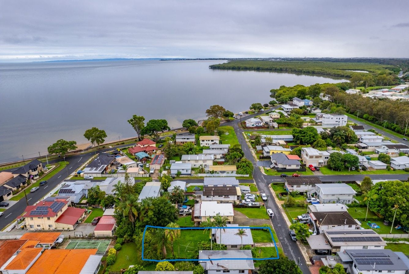 Aerial view of a Deception Bay street on the Moreton Bay foreshore, with one block outlined